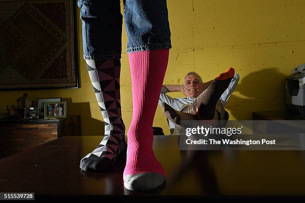 Peter Smiley, standing, vice president of BrightLife, and his partner, Kip Bright, president of BrightLife, right, wear their compression stockings...