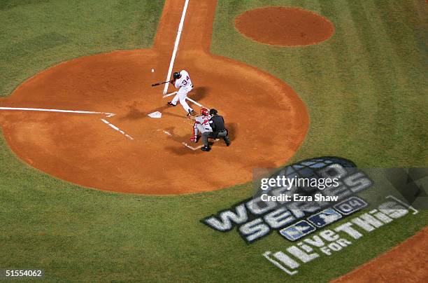 David Ortiz of the Boston Red Sox hits a three run home run in the first inning against the St. Louis Cardinals during game one of the World Series...