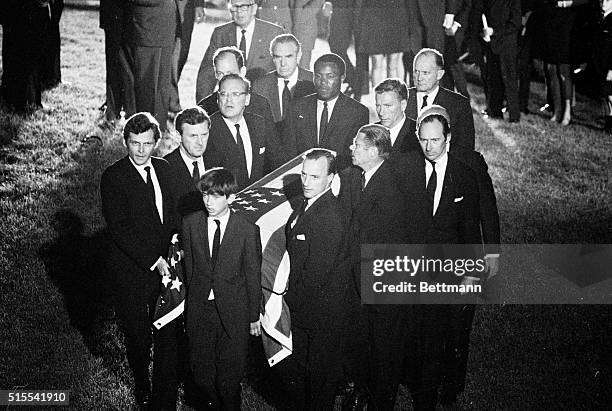 Robert F. Kennedy Jr., son of the slain Senator Robert F. Kennedy, leads pallbearers as they carry Senator Kennedy's casket to the gravesite at...