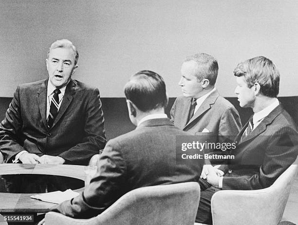 Sen. Eugene J. McCarthy answers question put to him by newsmen and his opponent, Sen. Robert F. Kennedy listens during their confrontation in a...