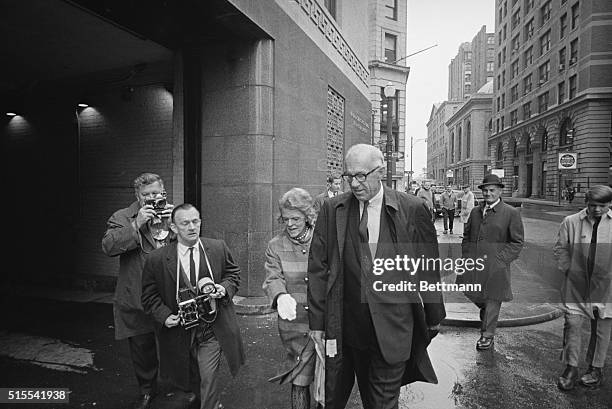 Dr. And Mrs. Benjamin Spock are shown on way to federal court where the doctor and four other men go on trial on charges of counseling against the...