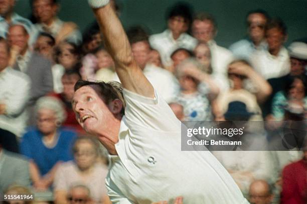 London, England: Rod Laver of Australia in action during his 9-7, 8-10, 6-4, 8-6 victory over Arthur Ashe of the USA in the semifinals of the men's...