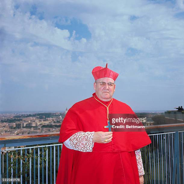 Rome: New Cardinal John Cody, Archibishop of Chicago, dressed for consistory tday posed for the press on rooftop garden of Hotel Hilton.