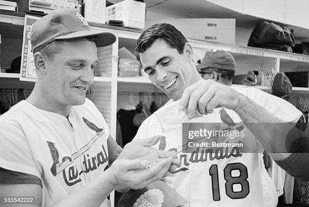 The lastest fad among the league leading St. Louis Cardinals is eating sunflower seeds. Third baseman Mike Shannon pours out a handful of the little...