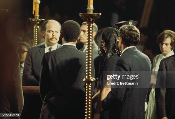 New York: Mrs. John F. Kennedy at the coffin of her brother-in-law, Senator Robert F. Kennedy, as it lies in state at St. Patrick's Cathedral.