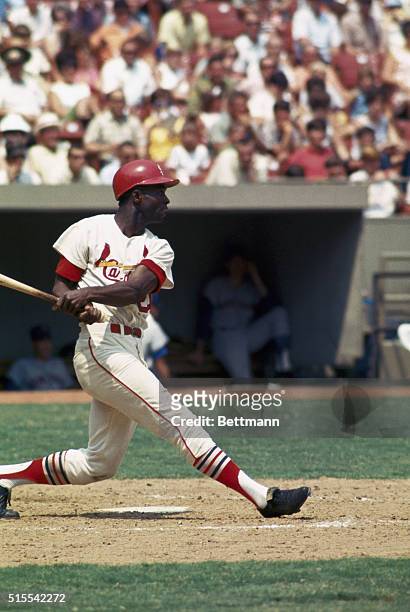 St. Louis: St. Louis Cardinals left fielder, Lou Brock is shown batting during game between St. Louis and the New York Mets.