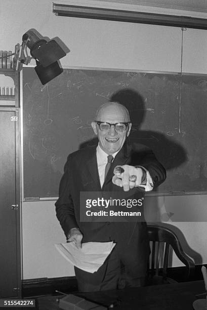 George Halas, a legend in professional football, gestures during news conference 5/27 where he announced he will retire as head coach of the Chicago...