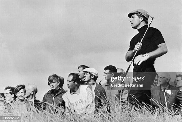 South Africa's Gary Player seems to one-hand it as he fires out of the rough on second fairway during second round play in the British Open Golf...