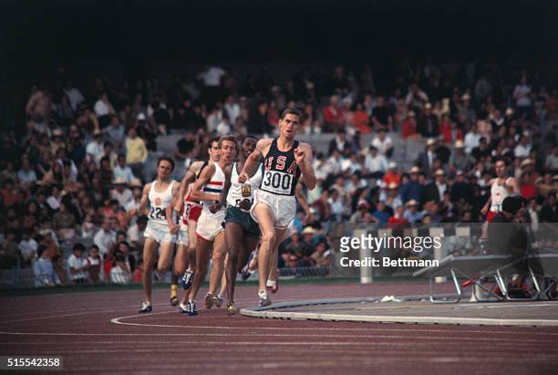 Jim Ryun of Wichita, Kansas, wins the 1500 meter run during semi-finals. Ryun would win the silver medal during the actual event. Behind at left is...