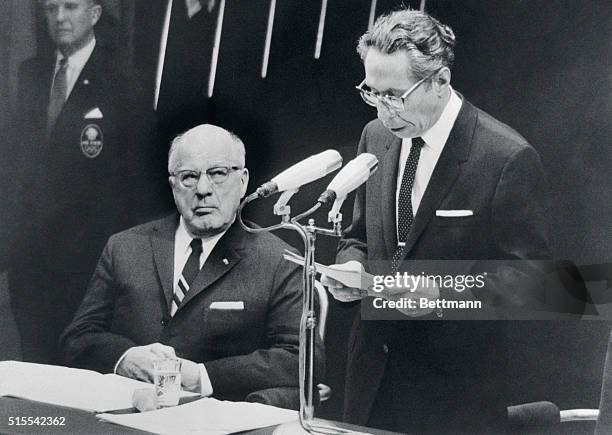 Avery Brundage , International Olympic Committee president, listens as President Gustavo Diaz Ordaz of Mexico makes oblique reference to the trouble...