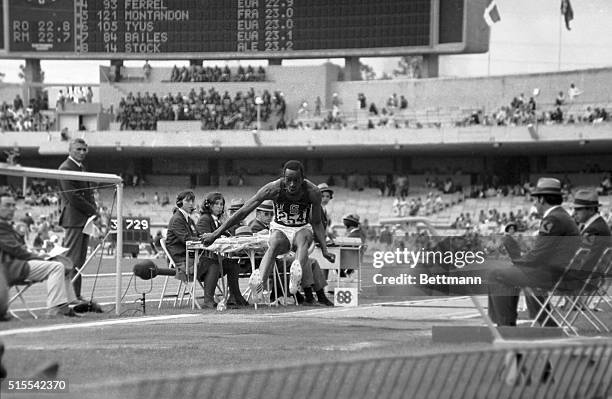 Robert Beamon shattering record at 1968 Olympics 29 ft. And 2 1/2 inches.
