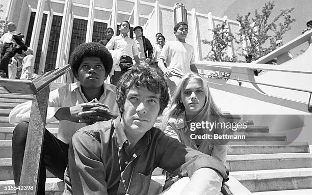 Los Angeles: Location shooting at the L.A. County Museum of Mod Squad, a television series. Clarence Williams III, Michael Cole, Peggy Lipton, sit...