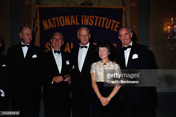 An awards dinner for the National Institute of Social Sciences Gold Medals, given annually for "distinguished service to humanity." Left to right:...