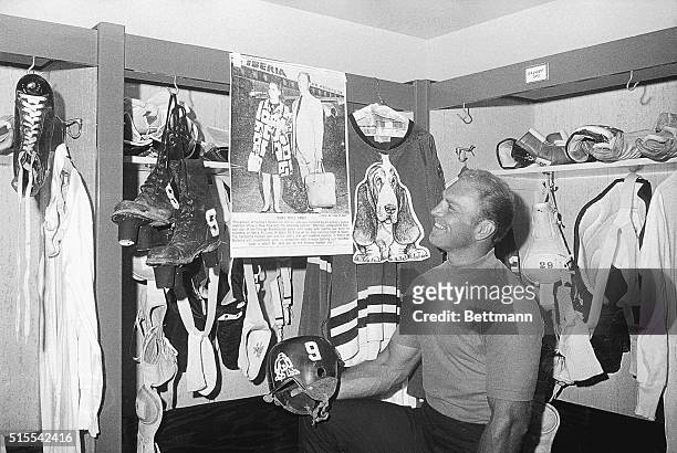 Chicago Black Hawks' Bobby Hull visits his locker at the start of pre-season training.