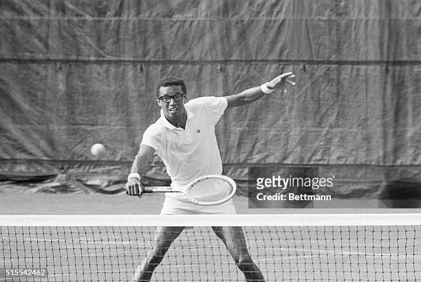Lt. Arthur Ashe smashes a return to Tom Okker of the Netherlands here, during their match for the men's singles title of the U. S. Open Tennis...