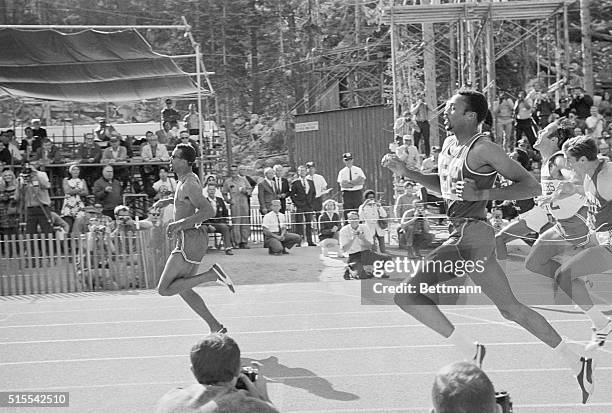 Record Breaker. South Lake Tahoe, Calif.: New York athlete John Carlos is shown at extreme left as he breaks the world's 200 Meter record here with...