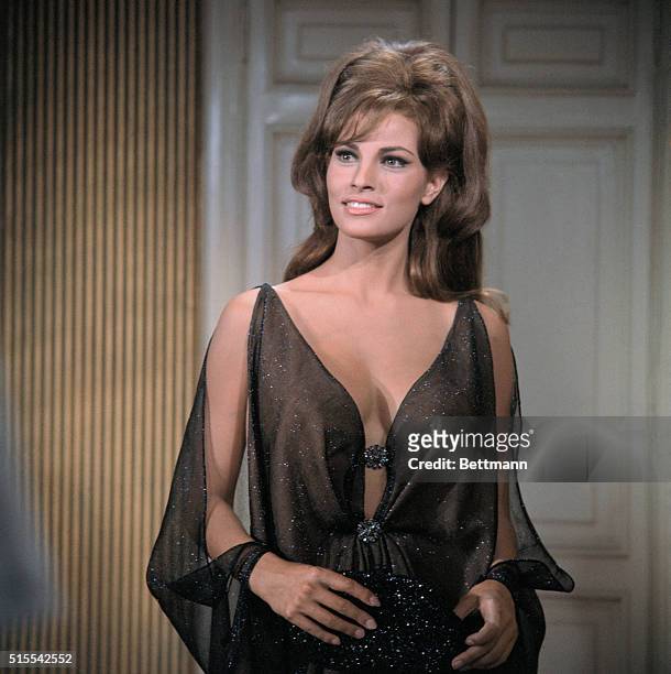 Actress Raquel Welch and actor Marcello Mastroianni, in scenes from movie Shout Loud, Louder, I Can't Hear You.