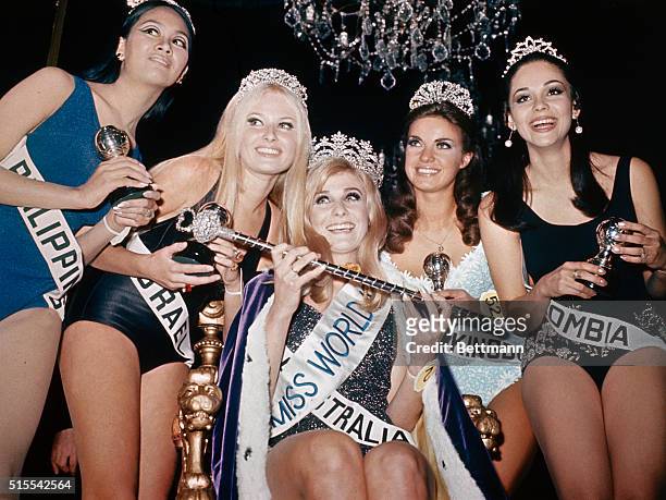 London: The new Miss World, 18 yr. Old Australian Penelope Plummer, is surrounded by the runners-up after being crowned at the Lyceum ballroom in...