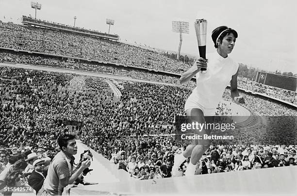 Mexico City: Mexico's Norma Enriqueta Basilio, the first woman in the history of the modern Olympic Games to light the Olympic Fire, runs up the...