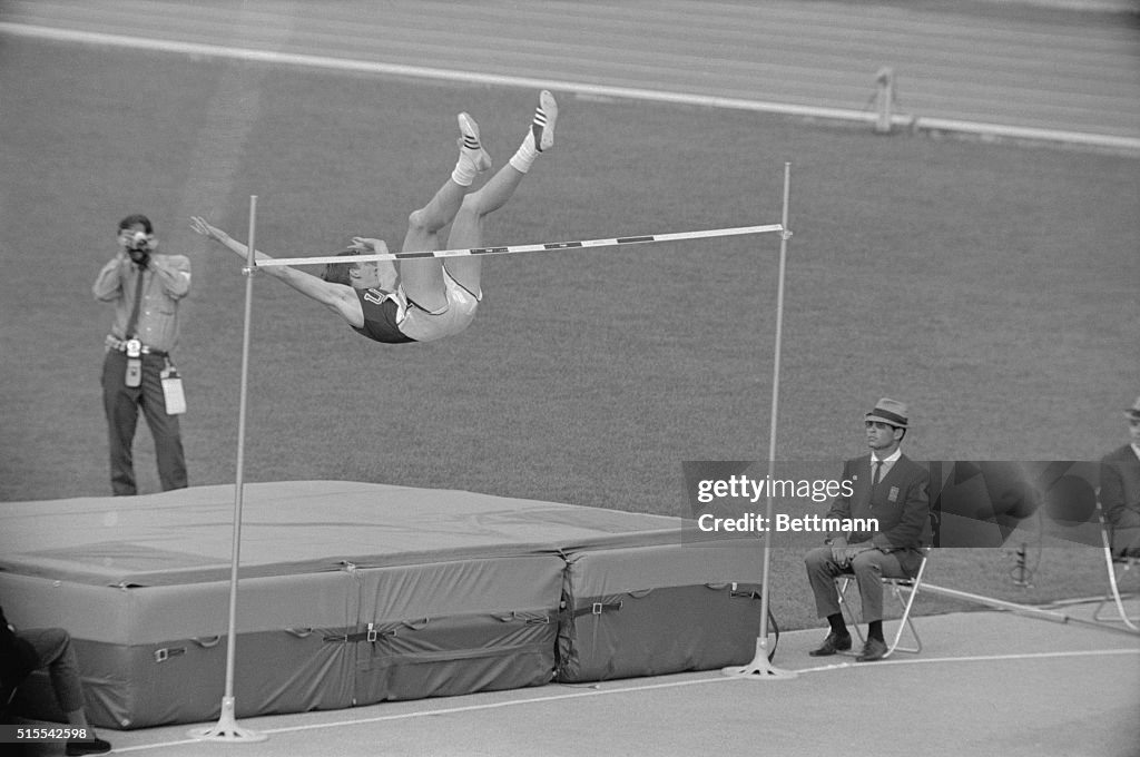 Dick Fosbury Leaping Backwards Over Olympic High Bar
