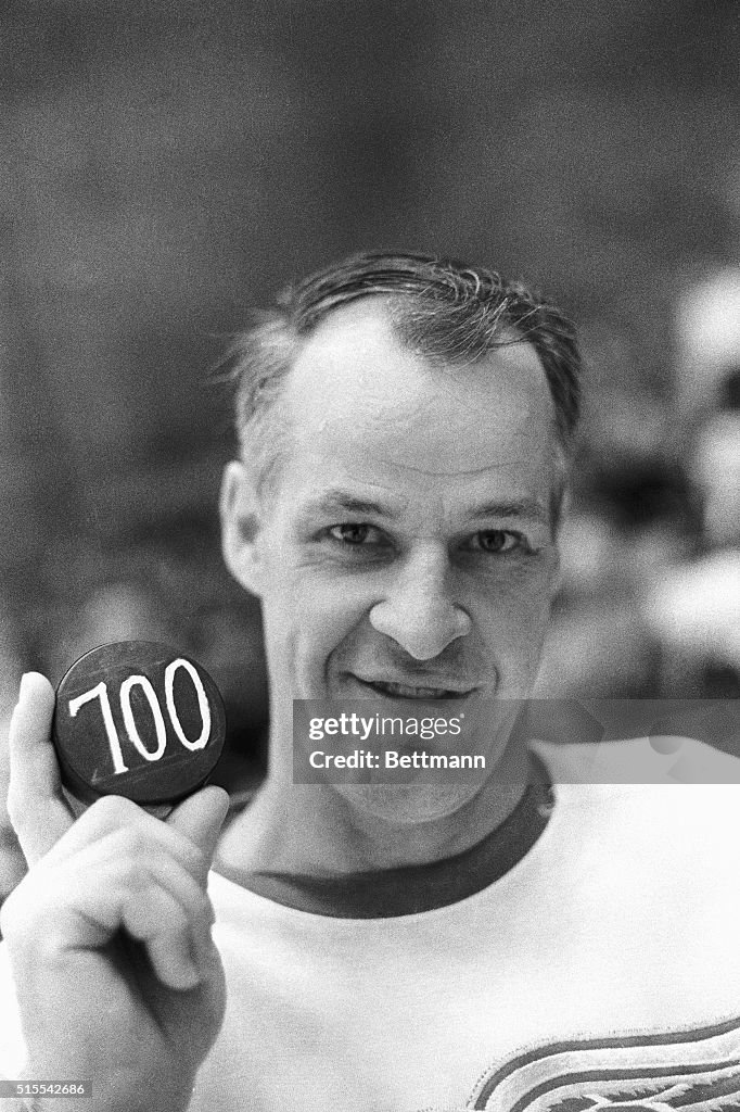 Gordon Howe Smiling With 700th Goal Puck