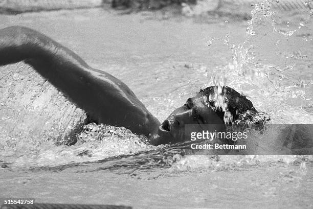 Mark Spitz, who set a new Olympic record for the 200-meter butterfly in 1968 Olympic trials, churns along 10/9 in a training pool. Spitz and another...