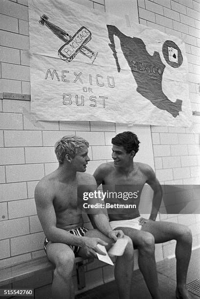 Don Schollander , quadruple 1964 Olympic gold medalist, of Lake Oswego, Oregon, jokes with fellow swimmer Mark Spitz of Santa Clara, California,...