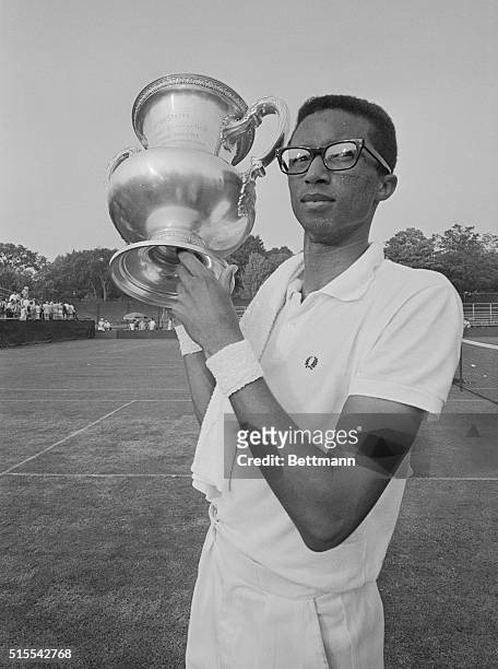 Chestnut Hill, MASS: Army lieutenant Arthur Ashe proudly displays trophy after winning the U.S. Men's Singles Tennis Championship at Longwood Cricket...