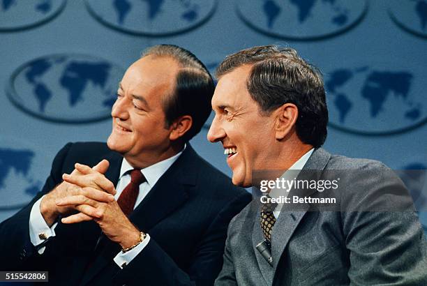 Washington: Democratic presidential candidate Vice President Hubert H. Humphrey huddles with his runningmate Sen. Edmund Muskie just prior to a...
