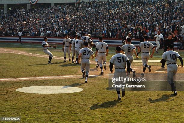 Busch Stadium, St. Louis, Mo.: Moment of triumph is reflected in the face of Detroit Tiger pitcher Mickey Lolich here as he is carried from field by...