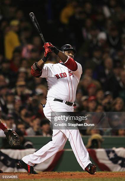 David Ortiz of the Boston Red Sox hits a two run home run against the St. Louis Cardinals during the first inning of game one of the World Series on...