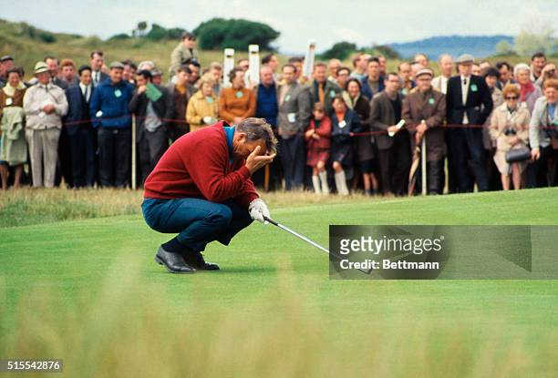 Arnold Palmer is shown holding his head as he kneels on the 3rd green, during the 97th British Open Golf Championship.