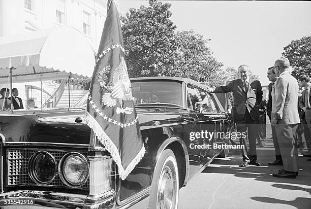 Washington, DC: President Johnson inspects the new presidential limousine, a 21-foot custom-built Lincoln Continental, that was delivered to the...