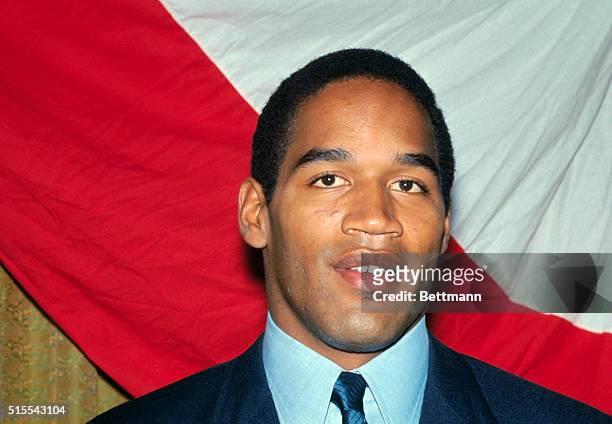 Closeups and interview pictures of O.J. Simpson of Southern California, the most celebrated collegiate football player of 1968, with his Heisman...
