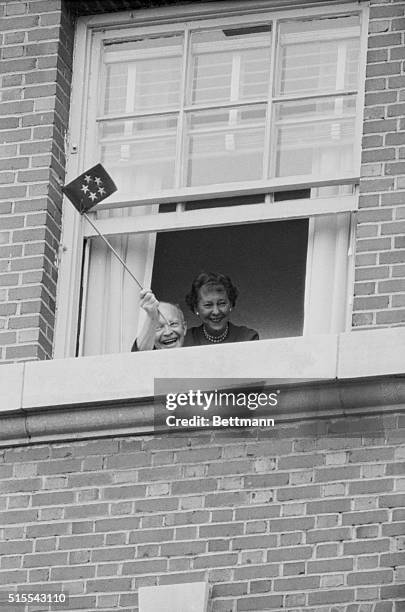 Former President Dwight D. Eisenhower waves a five star flag from the window of his room at Walter Reed Army Medical Center on his 78th birthday. The...