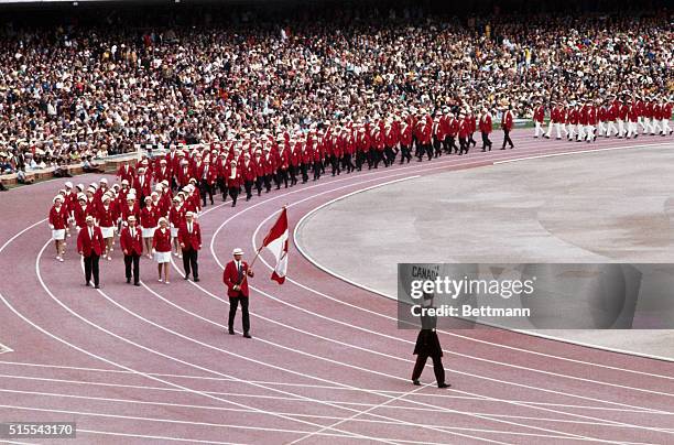 Mexico City, Mexico: Canada and Ceylon are among the teams marching into Olympic Stadium during opening ceremonies of the 1968 Olympic Games.