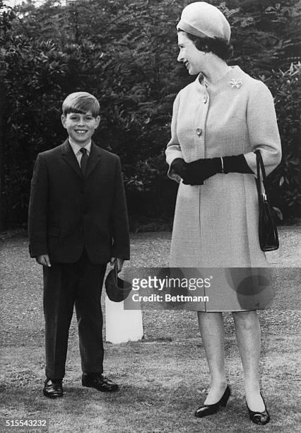 Proud mother. Ascot, England: Queen Elizabeth II smiles proudly as she accompanies her son, Prince Andrew, to Heatherdown Preparatory School at Ascot...
