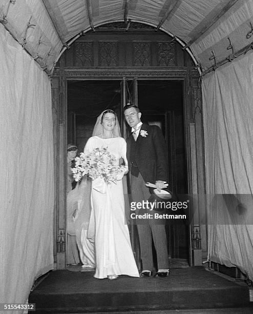 John D. Rockefeller III, marries Blanchette Ferry Hooker at the Riverside Church. The couple leaving the church after the ceremony.