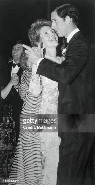 Manhattan, New York, New York: First Lady Nancy Reagan looks up into the eyes of the future king of England as she dances with Prince Charles at a...