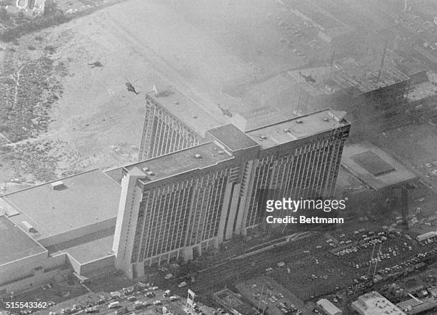 Several of the scores of helicopters used to rescue people from the roof of the MGM Grand Hotel can be seen hovering over the hotel here. At least 75...