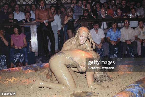 Two mudwrestlers in struggle at Chippendales in Los Angeles.