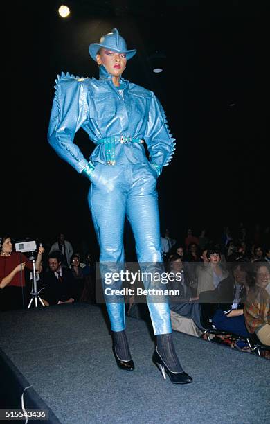 New York: Kansai Yamamoto for Cygne Designs takes a bold approach to Fall-Winter 1979-1980 with this blue embossed leather dragon sleeved rain suit,...