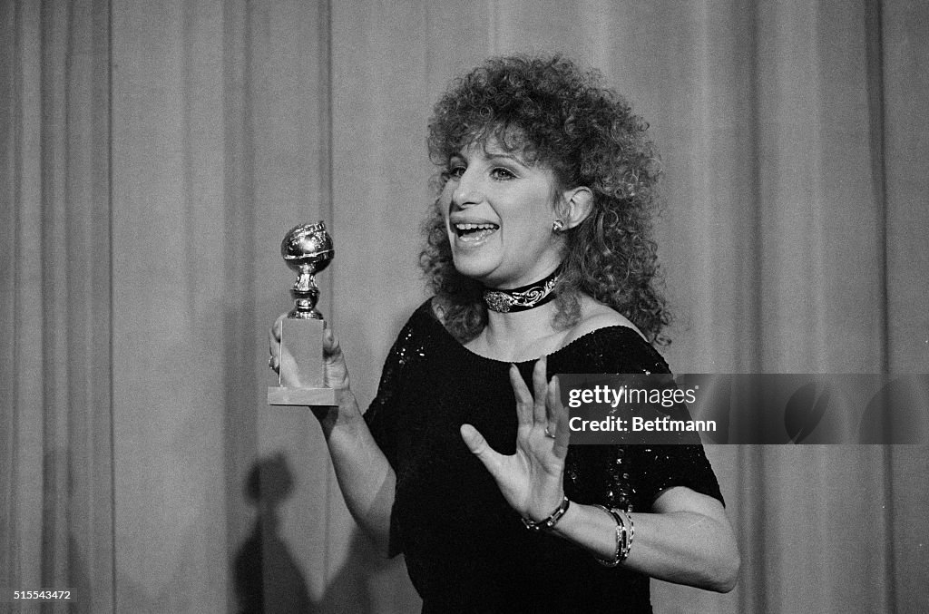 Barbra Streisand Holding Golden Globe Award