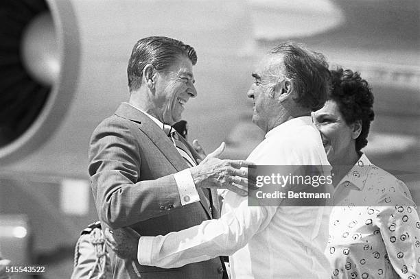 United States President Ronald Reagan receives an enthusiastic hug from Mexican President Jose Lopez Portillo on his arrival to attend the...