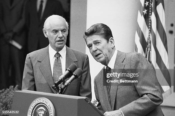 Washington: A grim faced President Reagan flanked by Attorney General William French Smith reads from a prepared text 8/3, on the strike by the...