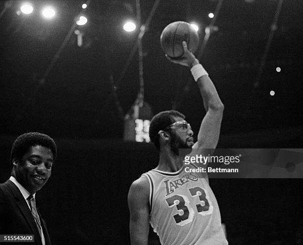 Oscar Robertson congratulates Los Angeles Lakers' Kareem Abdul-Jabbar, who broke Robertson's record for the second highest scorer in the NBA 12/1...