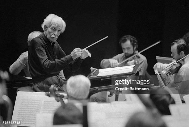 Boston Pops Maestro Arthur Fiedler warms up with orchestra during rehearsal at Symphony Hall for his upcoming 50th anniversary celebration 5/1....