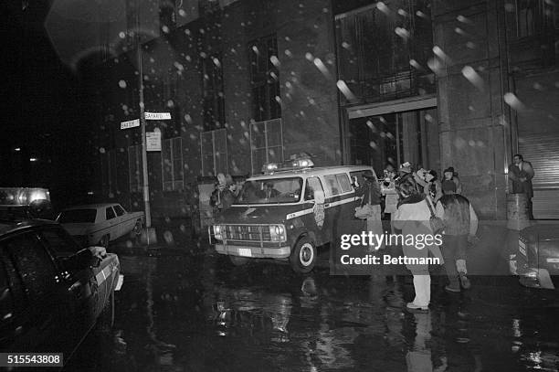 Police van with Mark David Chapman inside leaves Manhattan Criminal Court 12/9 after Chapman was arraigned on second-degree murder charge in the 12/8...