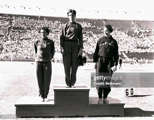 Winners in the 80-meter women's hurdle event are seen after their victory in the Los Angeles Olympic Stadium. Left to right: Evelyn Hall of the U.S....