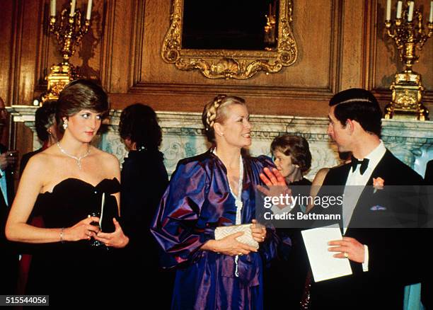 London, England: Prince Charles and Lady Diana Spencer with Princess Grace of Monaco in the Goldsmiths' Hall, City of London, for money-raising...
